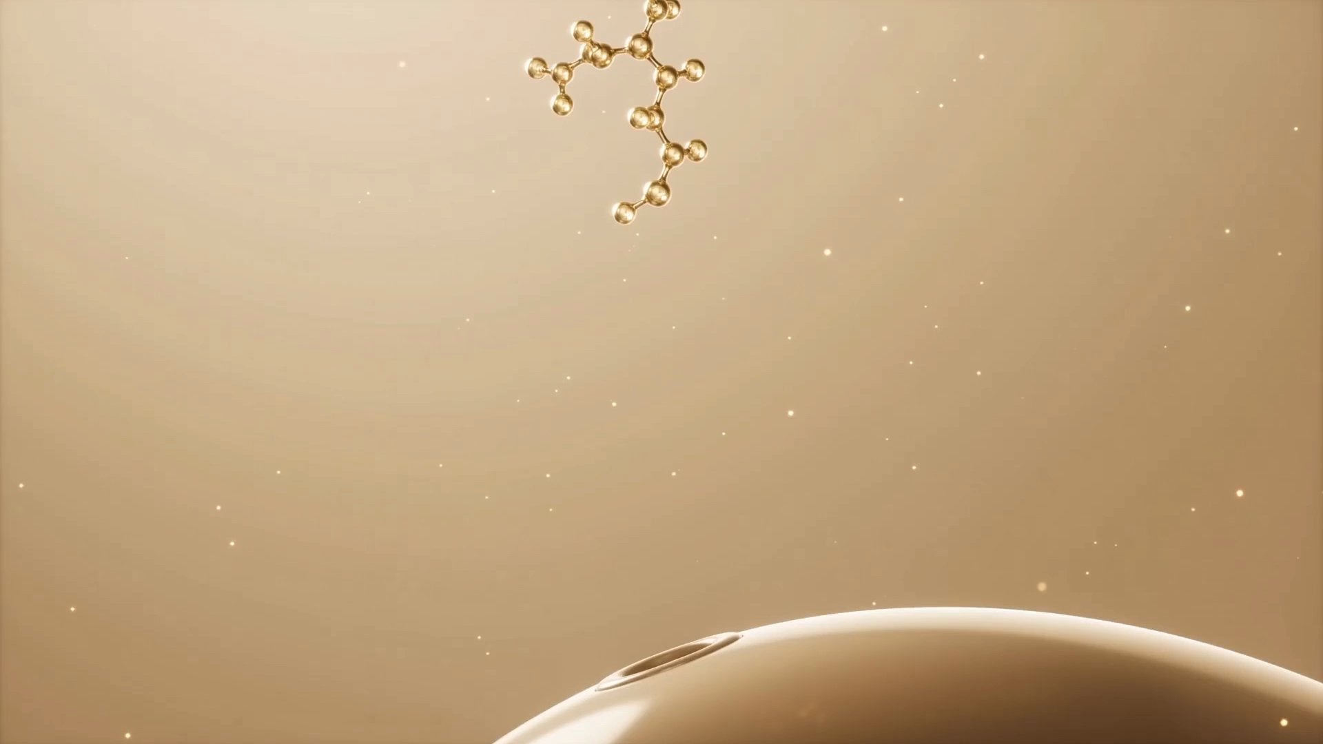 A branching chain of gold spheres on a cream ground — the shape of beta glucan.